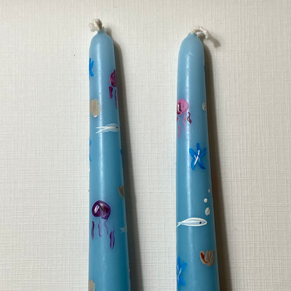 Candele in fondo al mar dipinte a mano
